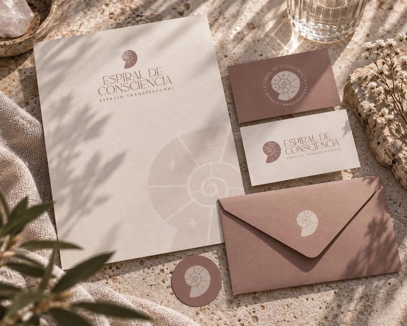 Stationery with an embossed spiral shell and a peach envelope