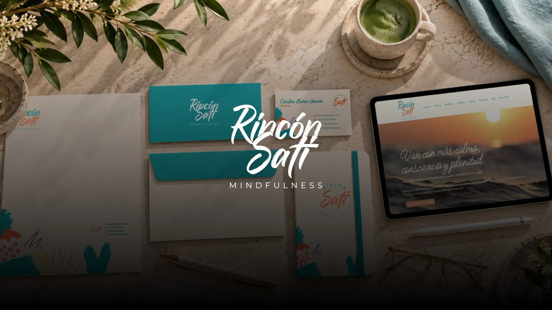 Rincón Sati Mindfulness stationery, tablet and logo on a table in natural light