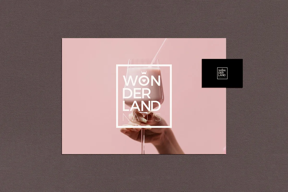 Pink postcard with the Wonderland Nails logo over a hand holding a glass